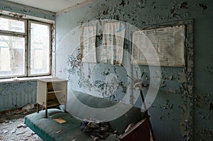 Devastation in room of hospital, dead abandoned ghost town of Pripyat in Chernobyl NPP alienation zone, Ukraine