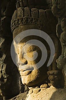 Devata sculpture in sunlight, Ta Prohm temple, Cambodia