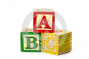 Develop and educate preschool kid, kindergarten class and learning the alphabet conceptual idea with colorful wooden toy blocks