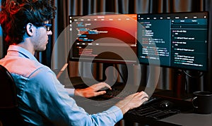 IT developer creating online software information coding on pc screen. Gusher.