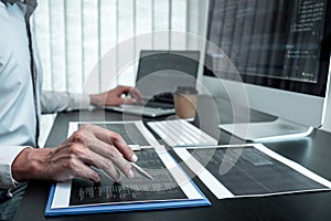 Developer programmer working on coding program software computer in office, Writing website and development database technology