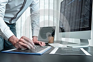 Developer programmer working on coding program software computer in office, Writing website and development database technology