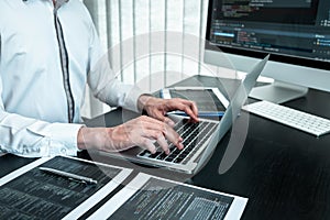 Developer programmer working on coding program software computer in office, Writing website and development database technology