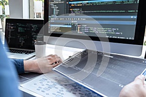 Developer programmer working on project in software development computer in IT company office, Writing codes and data code website