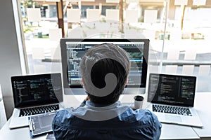 Developer programmer working on project in software development computer in IT company office, Writing codes and data code website