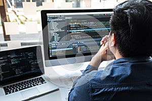 Developer programmer working on project in software development computer in IT company office, Writing codes and data code website