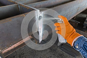 Developer spray into the welded with process Penetrant TestingPT