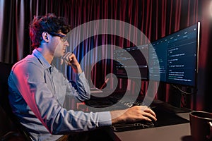 IT developer thinking online software information coding on pc screen. Gusher.