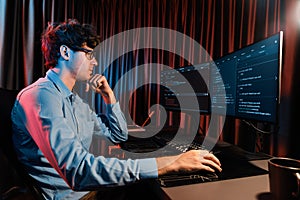 IT developer thinking online software information coding on pc screen. Gusher.