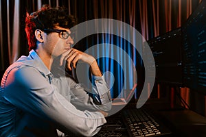 IT developer thinking online software information coding on pc screen. Gusher.