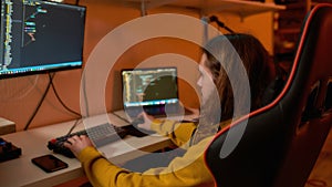 IT developer watching on monitor while programming