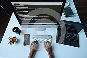 Developer working on computer at his workplace