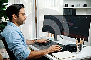 Developer working software development coding two computer code screen. Surmise.