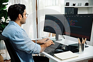 Developer working software development coding two computer code screen. Surmise.