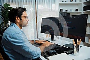 Developer working software development coding two computer code screen. Surmise.