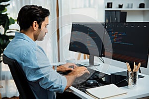 Developer working software development coding two computer code screen. Surmise.