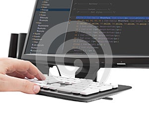 Developer working on source codes on computer at office