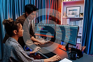 IT developers discussing with point website coding system. Infobahn.