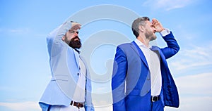 Developing business direction. Businessmen bearded faces stand back to back sky background. Men formal suit managers