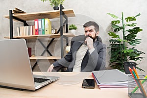 Developing business strategy. Risky business. Concentration and focus. Man bearded boss sit office with laptop. Manager
