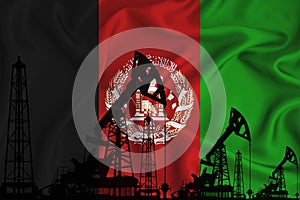 Developing Flag of Afghanistan. Silhouette of drilling rigs and oil rigs on a flag background. Oil and gas industry. The concept