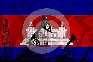 Developing Flag of Cambodia. Silhouette of drilling rigs and oil rigs on a flag background. Oil and gas industry. The concept of