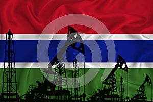 Developing Flag of Gambia. Silhouette of drilling rigs and oil rigs on a flag background. Oil and gas industry. The concept of oil