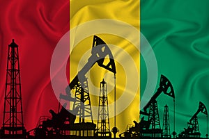 Developing Flag of Guinea. Silhouette of drilling rigs and oil rigs on a flag background. Oil and gas industry. The concept of oil