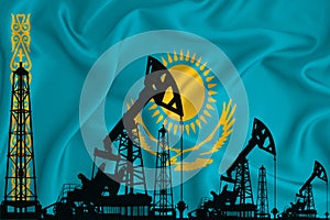 Developing Flag of Kazakhstan. Silhouette of drilling rigs and oil rigs on a flag background. Oil and gas industry. The concept of photo