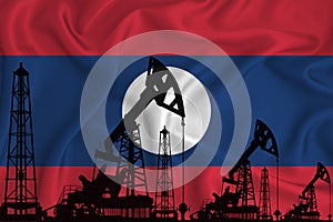 Developing Flag of Laos. Silhouette of drilling rigs and oil rigs on a flag background. Oil and gas industry. The concept of oil