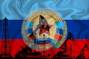 Developing Flag of Lugansk People`s Republic. Silhouette of drilling rigs and oil rigs on a flag background. Oil and gas industry