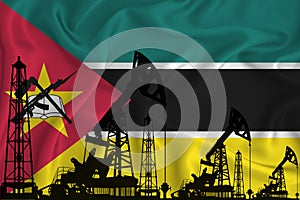 Developing Flag of Mozambique. Silhouette of drilling rigs and oil rigs on a flag background. Oil and gas industry. The concept of