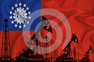 Developing Flag of Myanmar. Silhouette of drilling rigs and oil rigs on a flag background. Oil and gas industry. The concept of