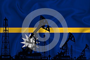 Developing Flag of Nauru. Silhouette of drilling rigs and oil rigs on a flag background. Oil and gas industry. The concept of oil