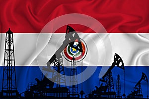 Developing Flag of Paraguai. Silhouette of drilling rigs and oil rigs on a flag background. Oil and gas industry. The concept of