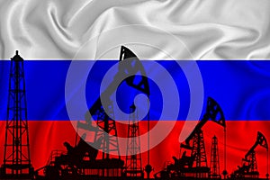 Developing Flag of Russia. Silhouette of drilling rigs and oil rigs on a flag background. Oil and gas industry. The concept of oil photo