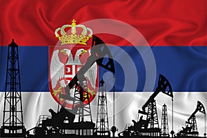 Developing Flag of Serbia. Silhouette of drilling rigs and oil rigs on a flag background. Oil and gas industry. The concept of oil