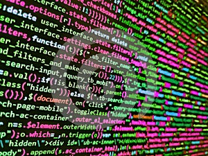 Developing programming binary code. Screen of web developing php code on dark background. Background of software developer script