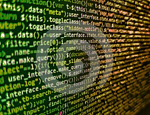 Developing programming binary code. Software developer programming code on computer monitor. Code of javascript language on white