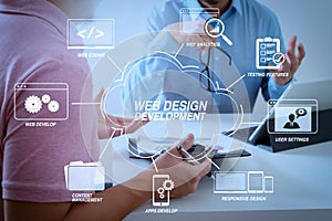 Businessmen working together on a document and using smart phone