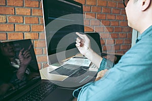 Developing programming and coding technologies working in a software engineers developing applications together in office