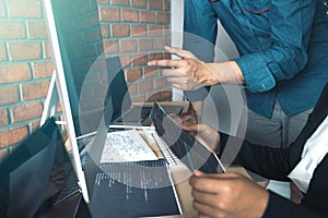 Developing programming and coding technologies working in a software engineers developing applications together in office