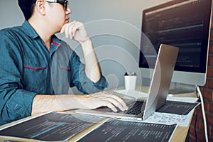 Developing programming and coding technology working in a software develop company office