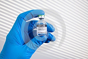 Development and creation of a coronavirus vaccine COVID-19. Coronavirus Vaccine concept in hand of doctor vaccine jar.