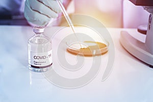 Development and creation of a coronavirus vaccine COVID-19 .Coronavirus Vaccine concept in lab with hand of doctor. Vaccine