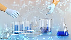 Development and research of laboratory chemicals liquid with the hands of scientists and chemical fluids to test. chemistry