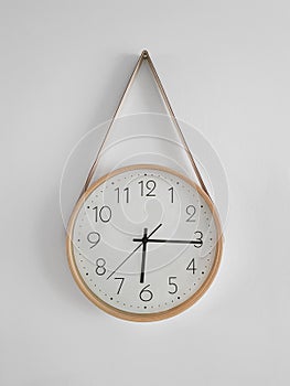 deviant classic clock hanging on a white wall photo