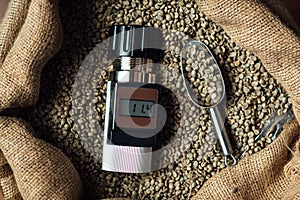 Device for measuring the humidity of coffee beans in a bag with a metal scoop, top view