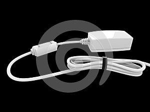 Device with white cable bent and coiled up and held with black rubber band