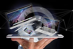 Devices like smartphone, tablet or computer flying over connection network - 3d render